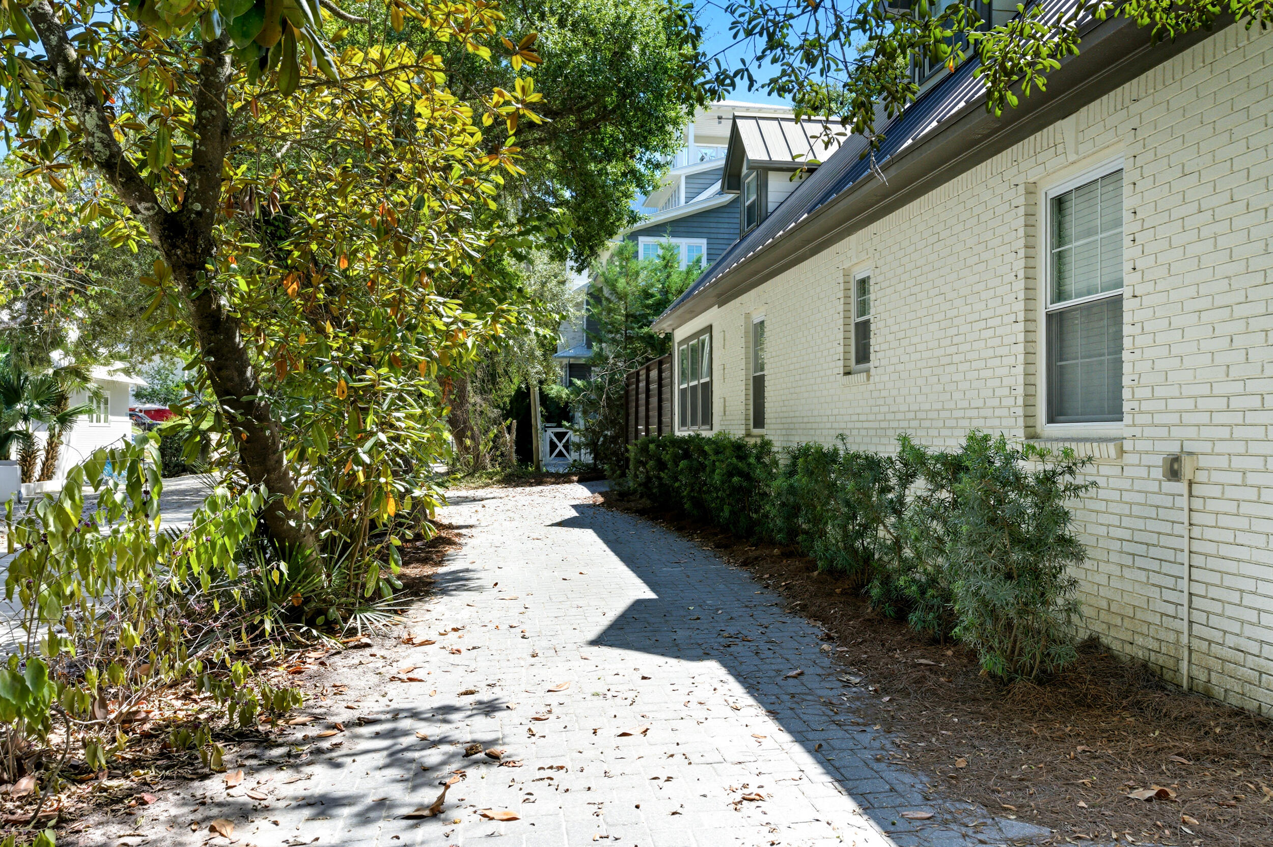 144 Hickory Street Santa Rosa Beach, FL 32459 - Photo 52 of 60 a pathway of a house with potted plants