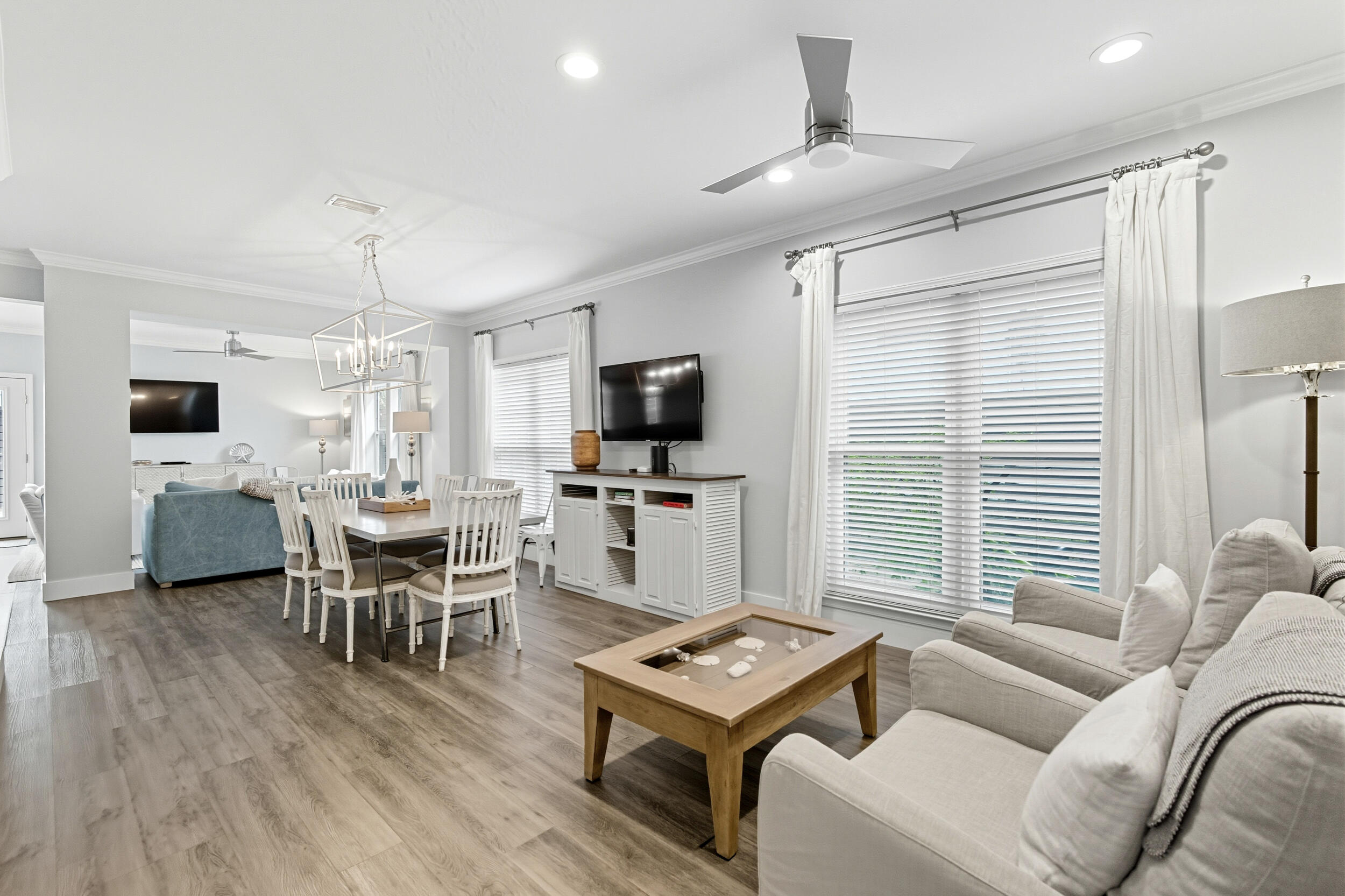144 Hickory Street Santa Rosa Beach, FL 32459 - Photo 7 of 60 a living room with furniture a flat screen tv and a large window