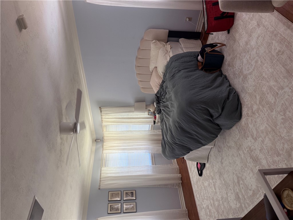 900 Winding Road College Station, TX 77840 - Photo 2 of 6 a bedroom with a bed and a window