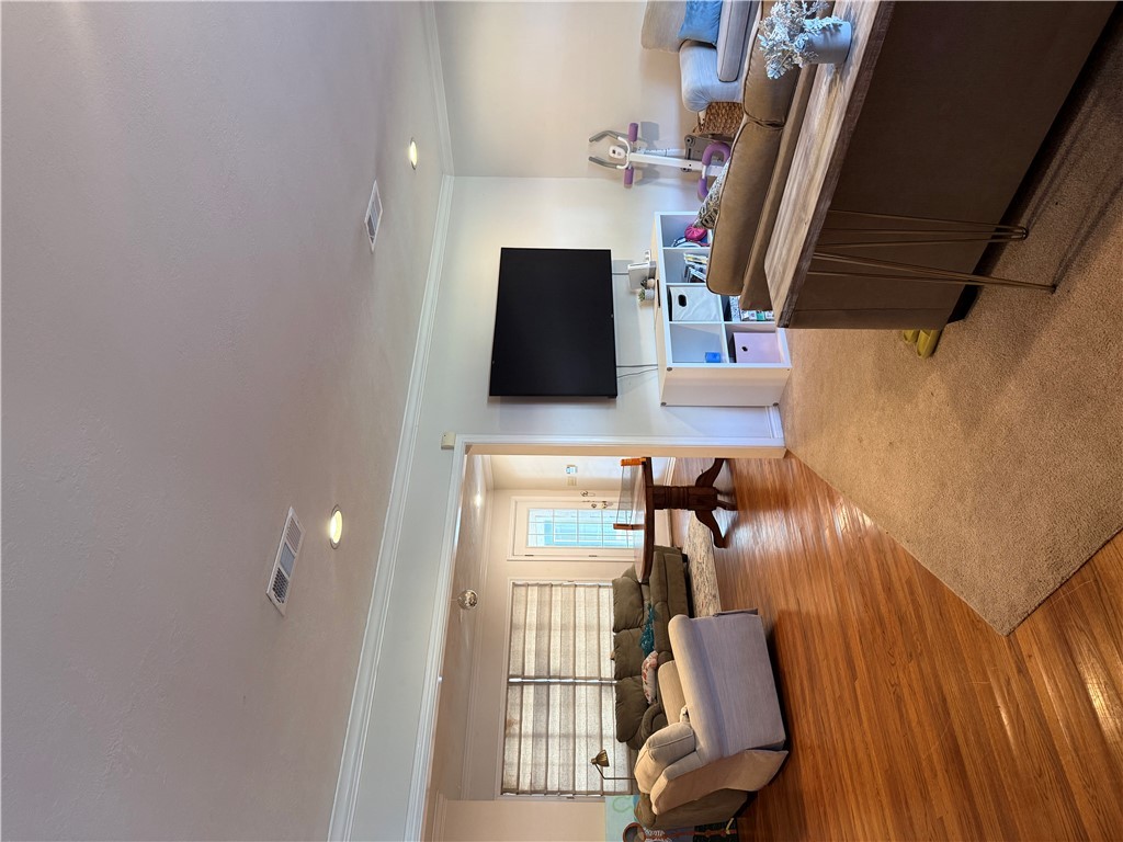 900 Winding Road College Station, TX 77840 - Photo 3 of 6 a living room with furniture and a flat screen tv