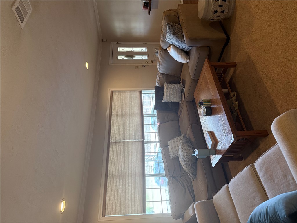 900 Winding Road College Station, TX 77840 - Photo 6 of 6 a living room with furniture and a large window