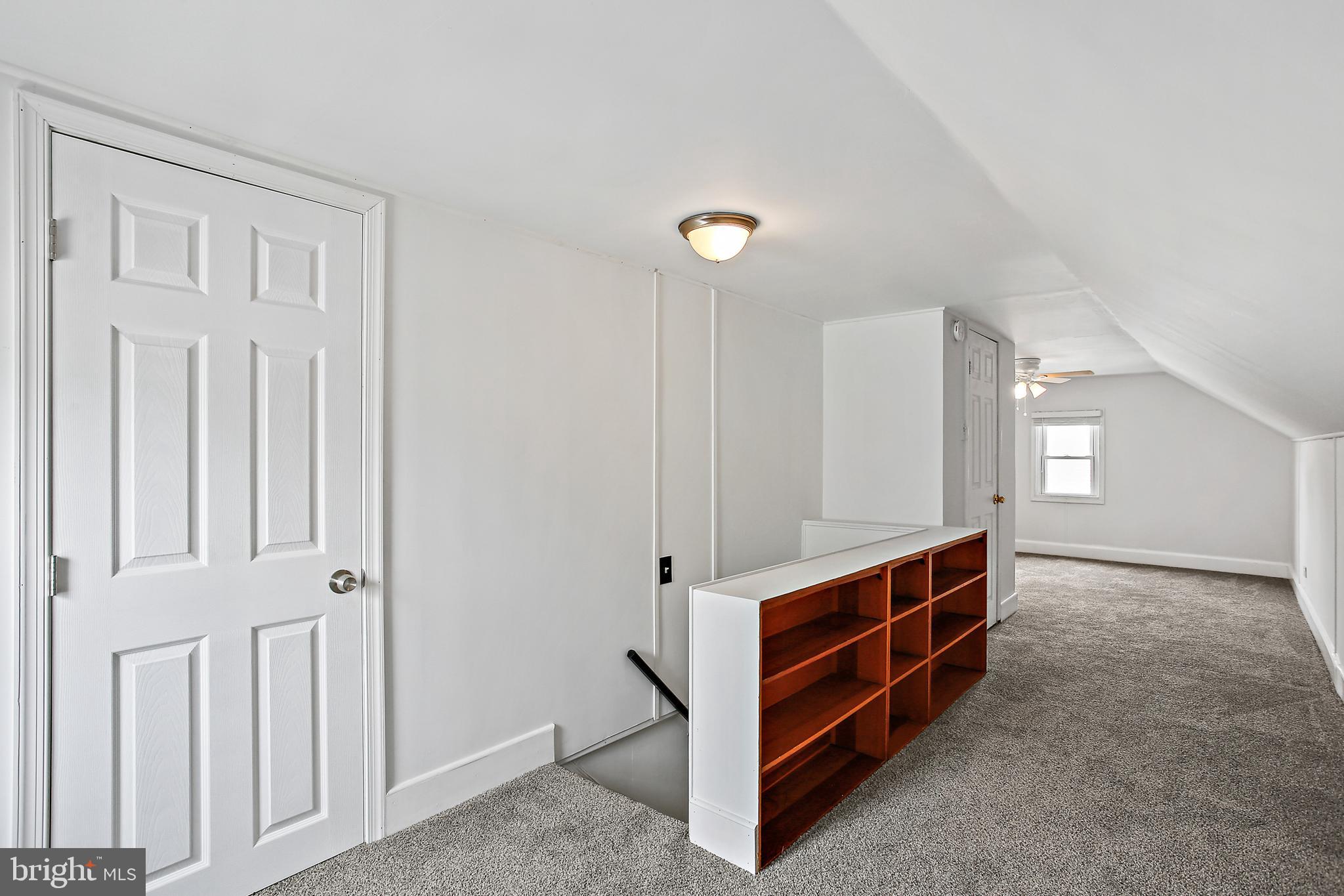 301 Townsend Road Essex, MD 21221 - Photo 15 of 33 a view of room with stairs and a ceiling fan