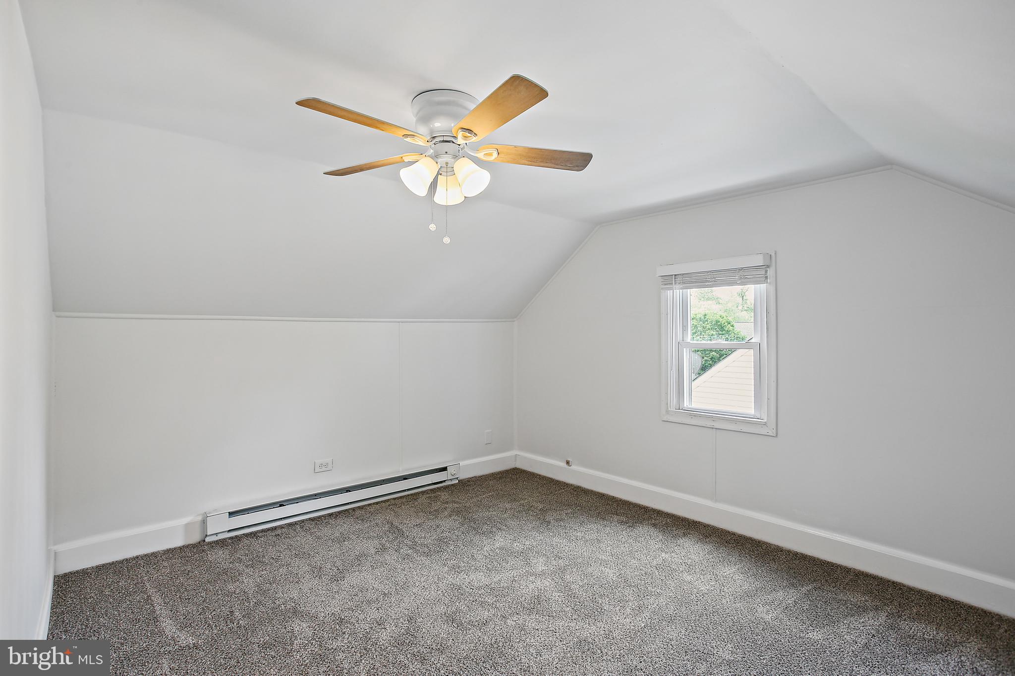 301 Townsend Road Essex, MD 21221 - Photo 19 of 33 an empty room with a window and a fan