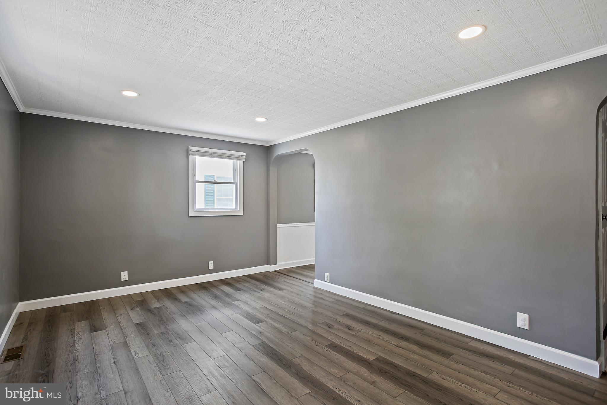 301 Townsend Road Essex, MD 21221 - Photo 21 of 33 a view of room with window and wooden floor