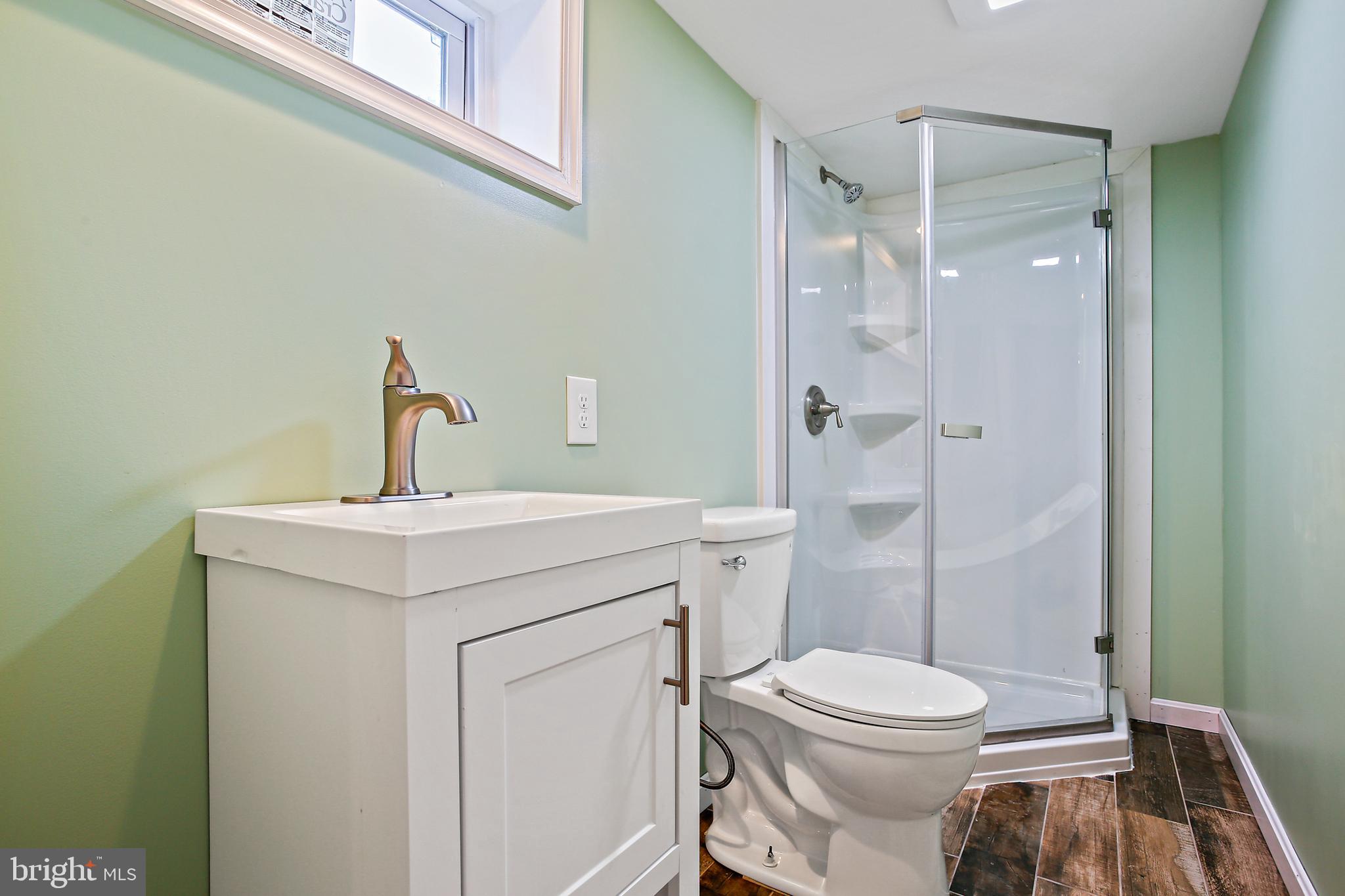 301 Townsend Road Essex, MD 21221 - Photo 26 of 33 a bathroom with a sink toilet and shower