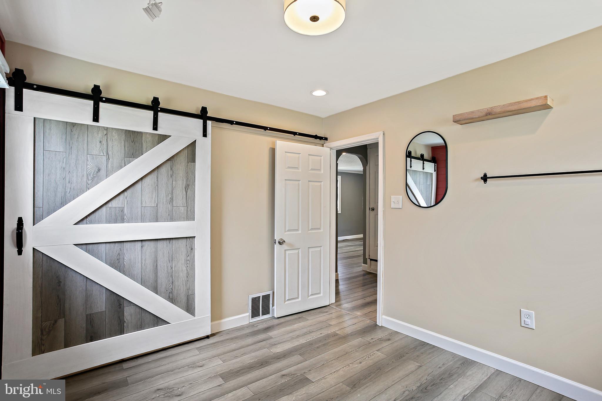 301 Townsend Road Essex, MD 21221 - Photo 28 of 33 a view of a hallway with entryway wooden floor and front door