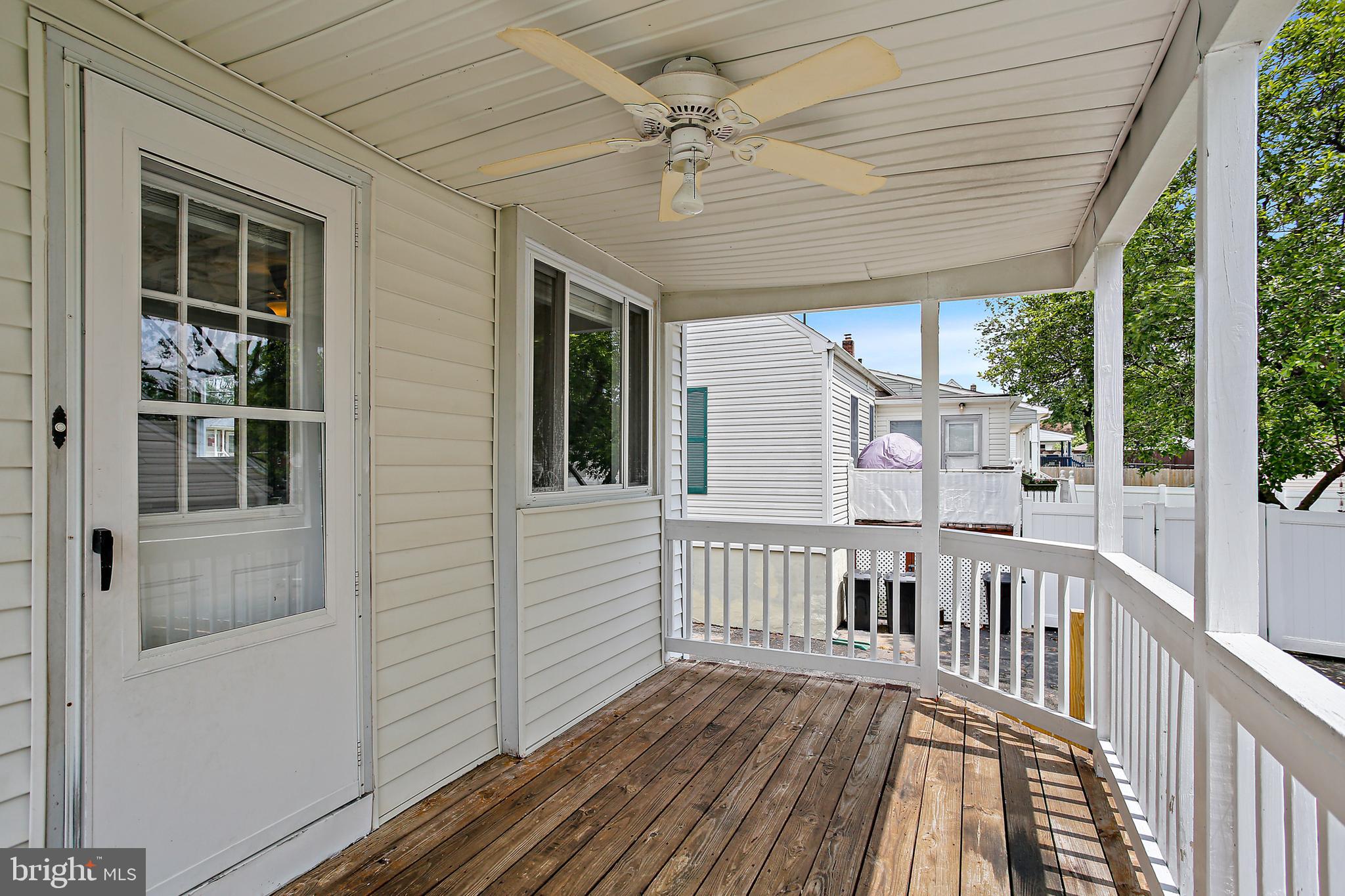 301 Townsend Road Essex, MD 21221 - Photo 5 of 33 a view of a house with porch and wooden floor
