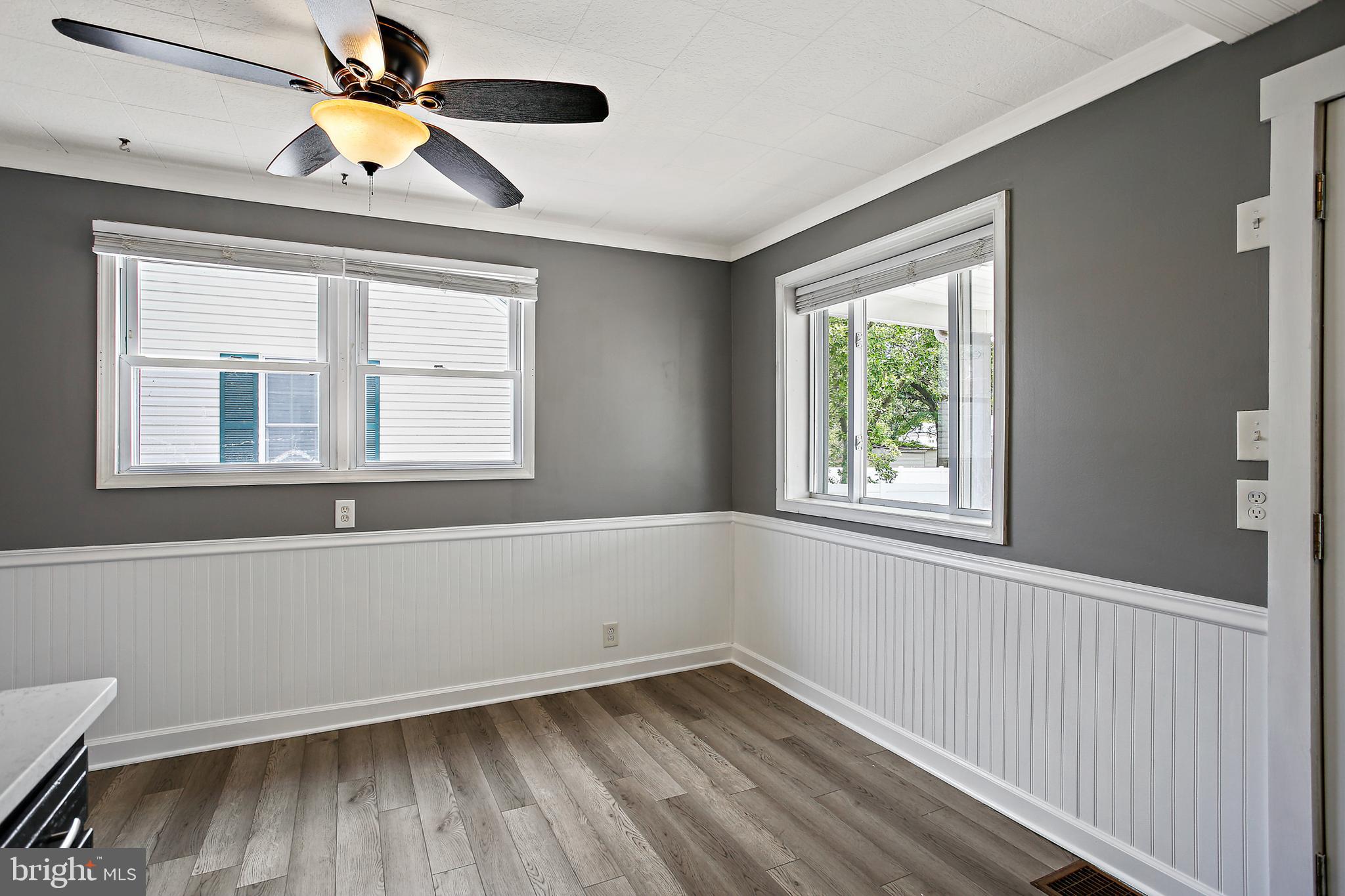 301 Townsend Road Essex, MD 21221 - Photo 9 of 33 a view of an empty room with wooden floor and a window