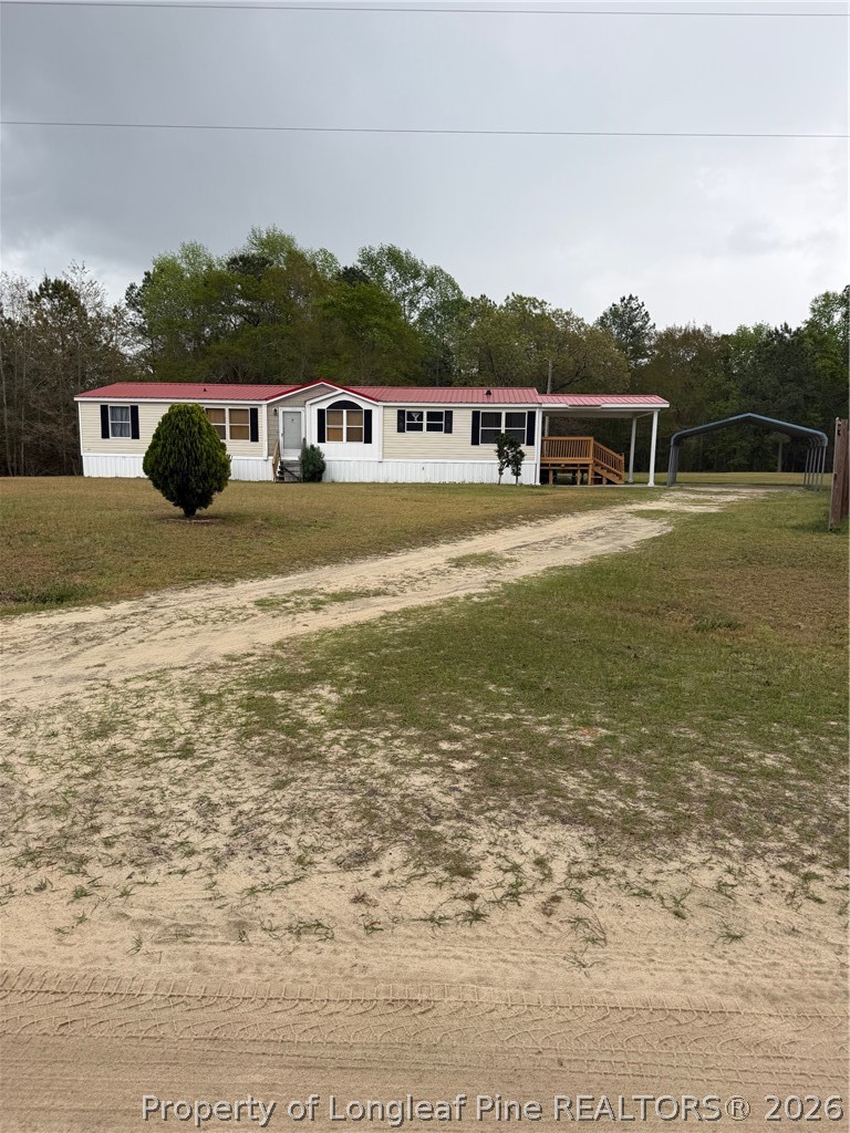 55 Academy Way Tar Heel, NC 28392 - Photo 1 of 8 a front view of a house with a yard