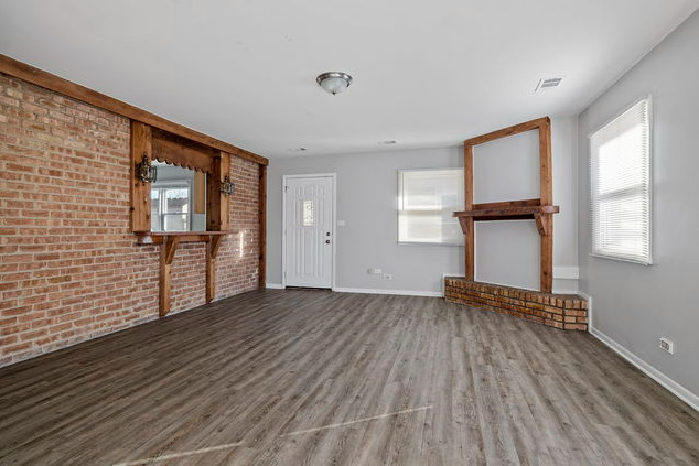 547 Regent Road University Park, IL 60484 - Photo 8 of 14 an empty room with wooden floor and windows