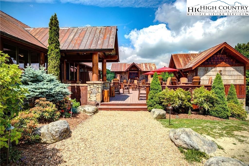 80 Lands End Trail Banner Elk, NC 28604 - Photo 12 of 31 a front view of a house with a yard