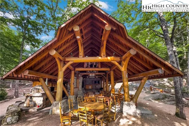 a view of a flower garden in front of a house