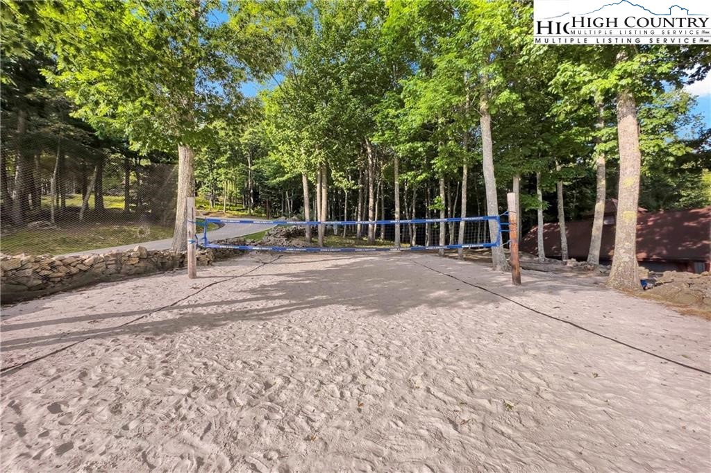 80 Lands End Trail Banner Elk, NC 28604 - Photo 19 of 31 a backyard of a house with large trees and wooden fence