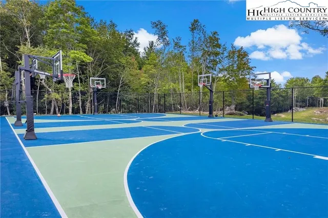 a aerial view of a house with swimming pool garden and patio