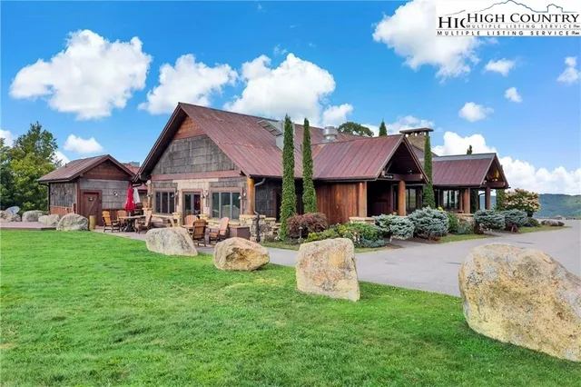 a sign that is in front of flowers