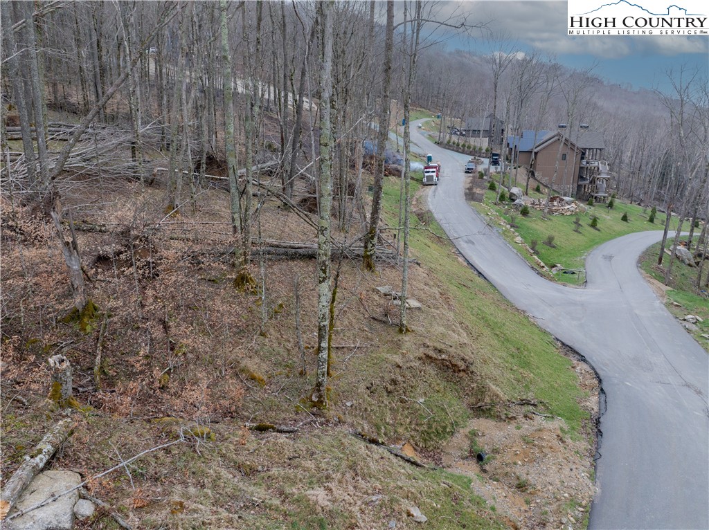 80 Lands End Trail Banner Elk, NC 28604 - Photo 5 of 31 a view of a wooden house with a yard