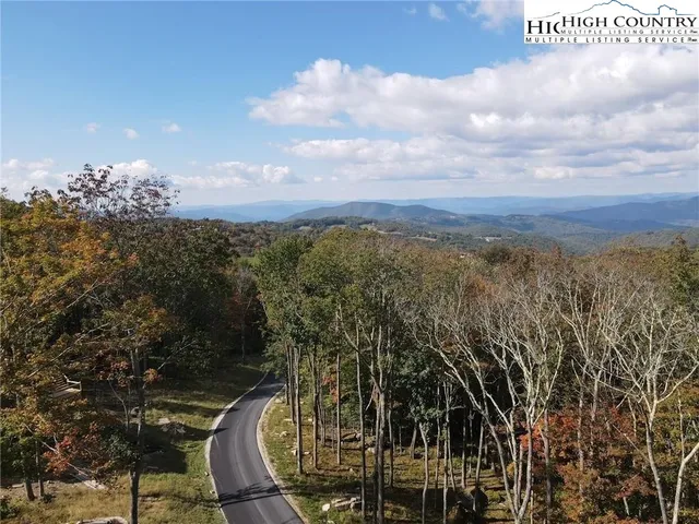 a view of a swimming pool with a table and chairs