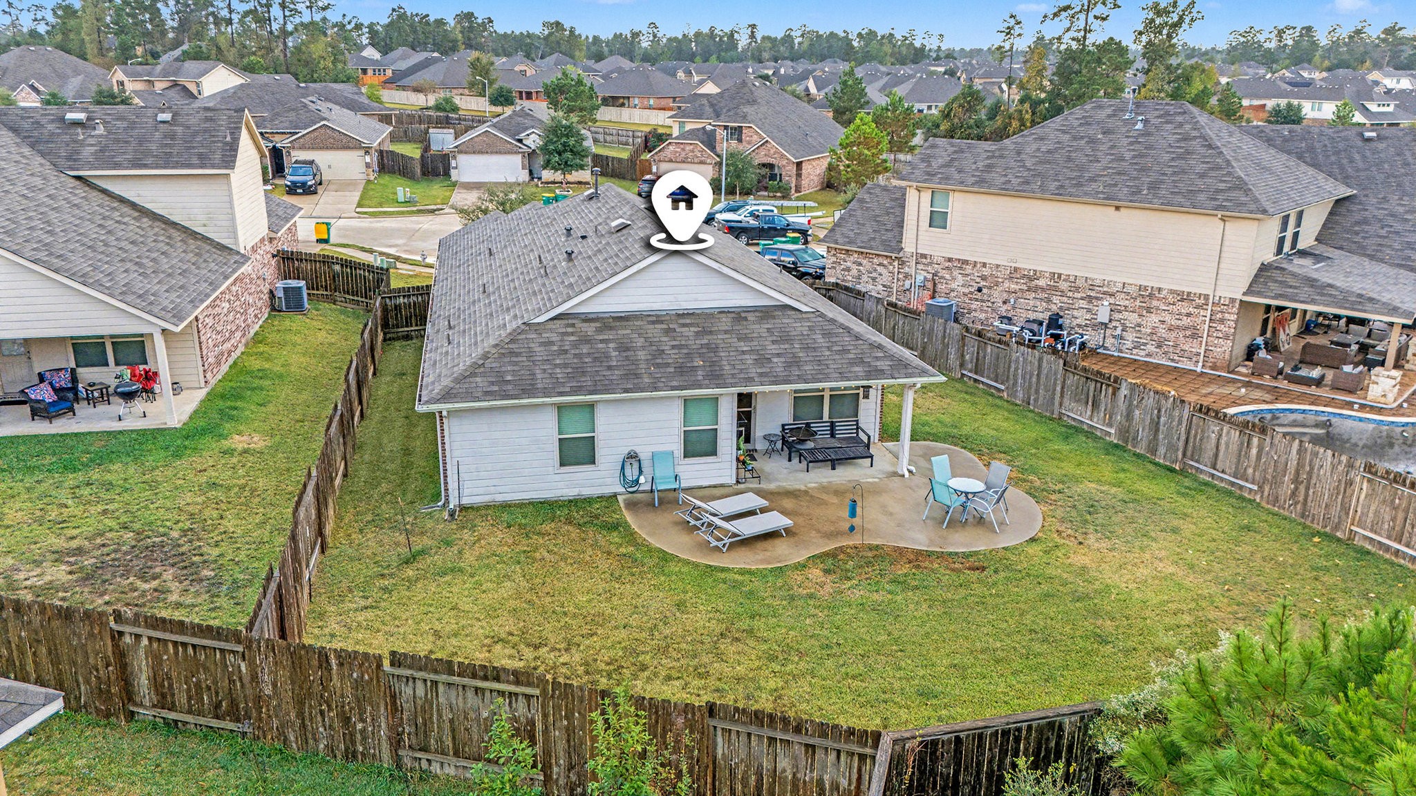 14106 Locke Point Court Conroe, TX 77384 - Photo 30 of 34 Aerial of the Spacious Backyard with Extended Patio
