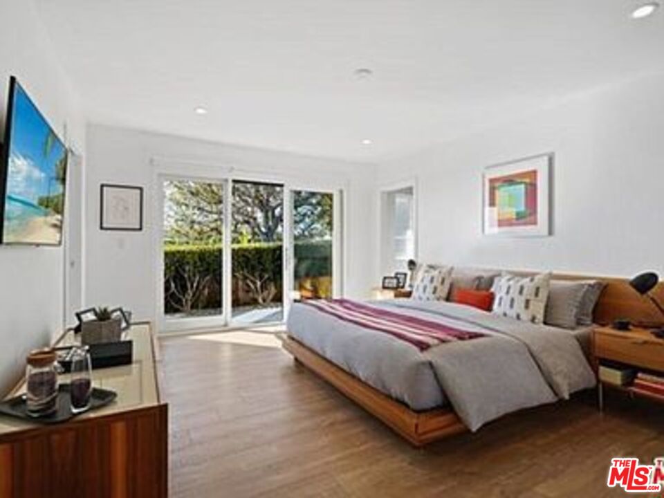 Roca Chica Drive Malibu, CA 90265 - Photo 15 of 34 a bed room with a bed and a chair