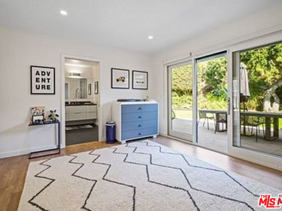 Roca Chica Drive Malibu, CA 90265 - Photo 19 of 34 a living room with furniture and large windows