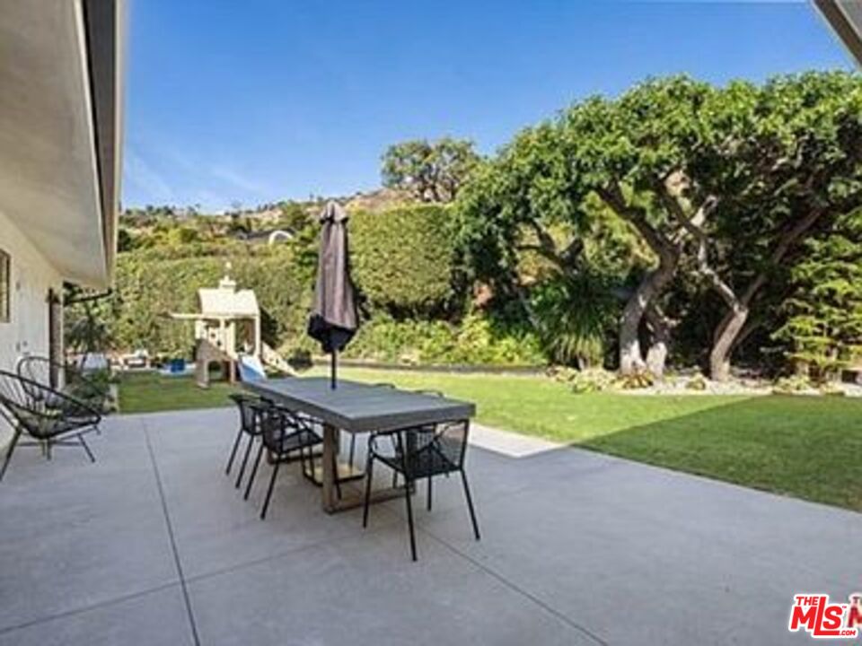 Roca Chica Drive Malibu, CA 90265 - Photo 25 of 34 a view of a backyard with sitting area