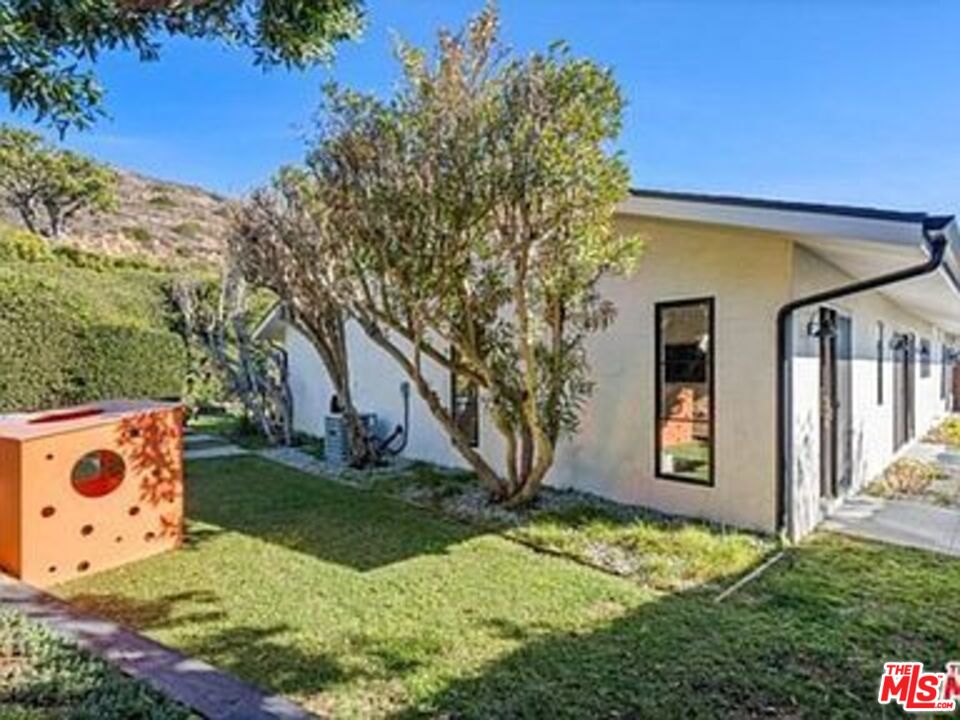 Roca Chica Drive Malibu, CA 90265 - Photo 29 of 34 a front view of a house with garden