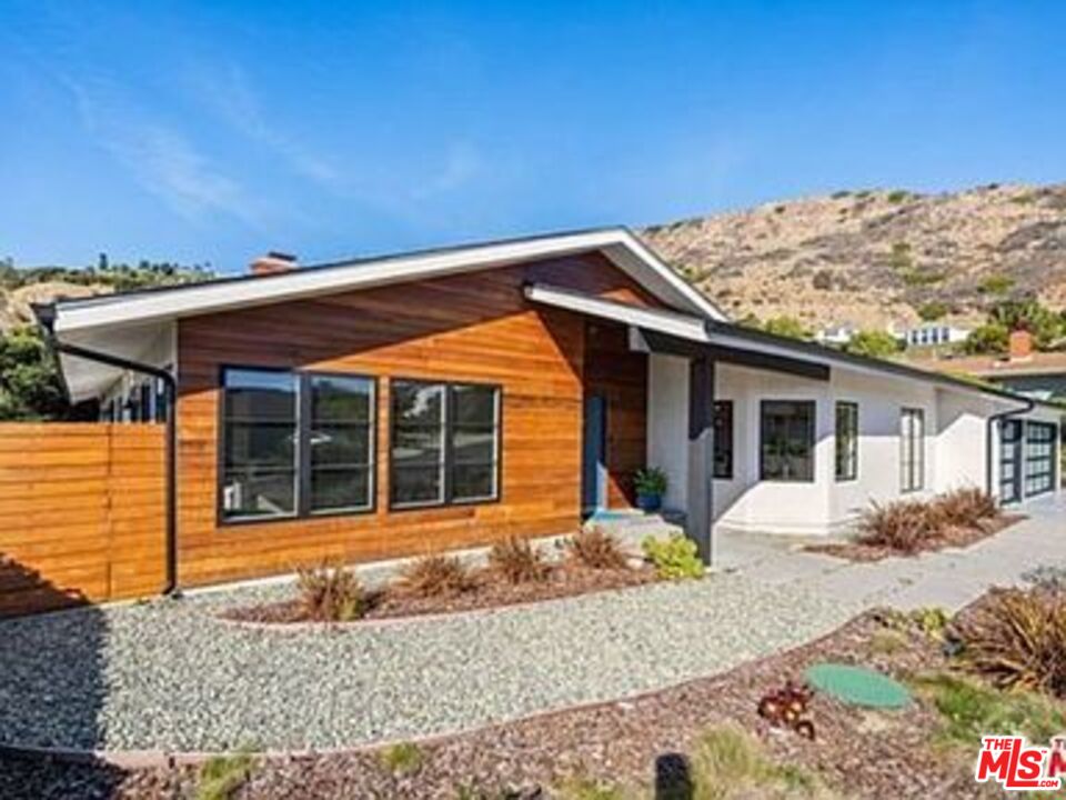 Roca Chica Drive Malibu, CA 90265 - Photo 31 of 34 a view of a house with a snow in the background