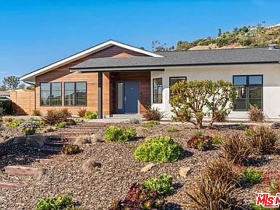 Roca Chica Drive Malibu, CA 90265 - Photo 32 of 34 a front view of a house with garden