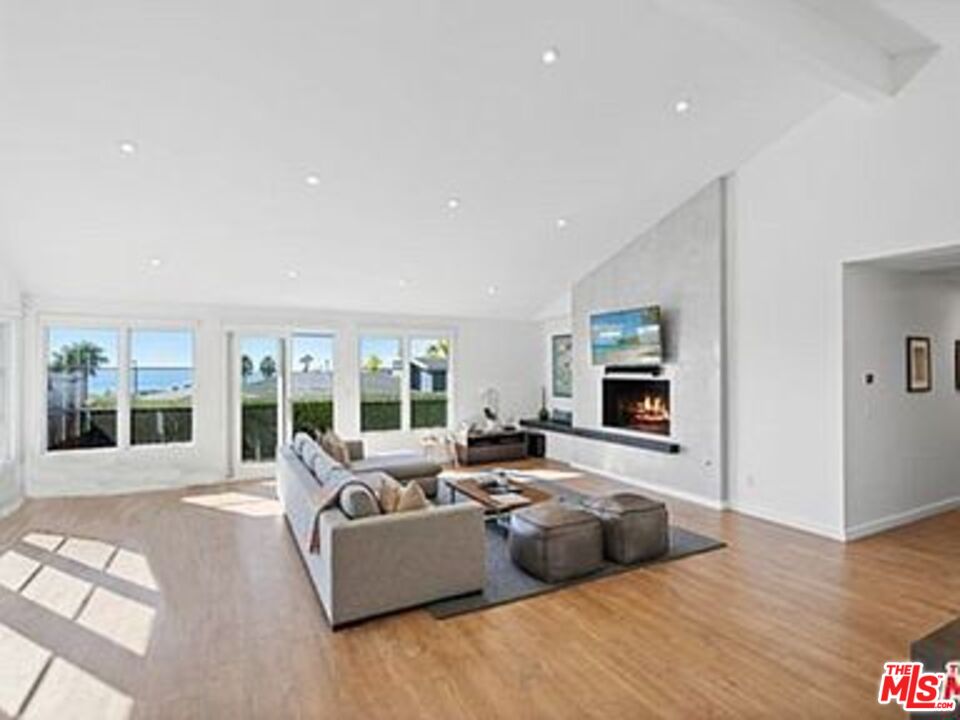 Roca Chica Drive Malibu, CA 90265 - Photo 5 of 34 a living room with furniture large window and flat screen tv