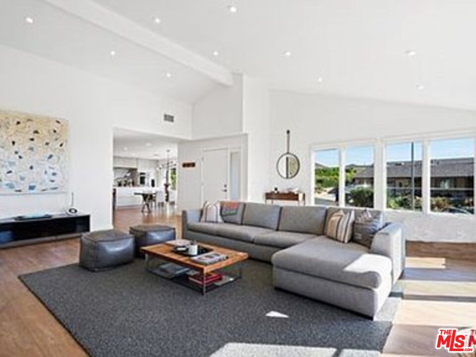 Roca Chica Drive Malibu, CA 90265 - Photo 6 of 34 a living room with furniture and a large window