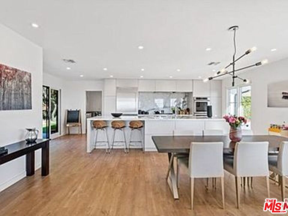 Roca Chica Drive Malibu, CA 90265 - Photo 7 of 34 a large kitchen with a table and chairs