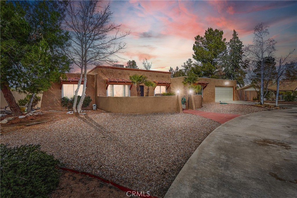 14260 Flathead Road Apple Valley, CA 92307 - Photo 1 of 1 a front view of a house with a yard