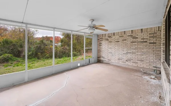 a view of a room with a large window