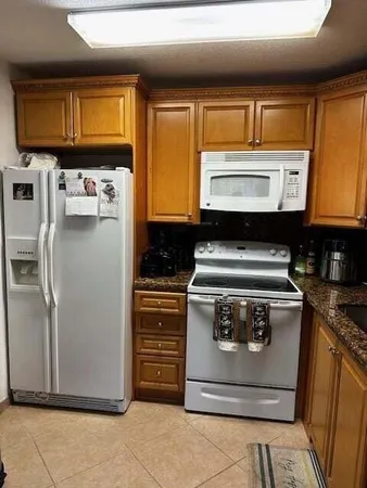 a kitchen with a stove and a microwave