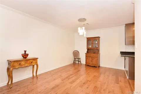 a view of a livingroom with furniture and a window