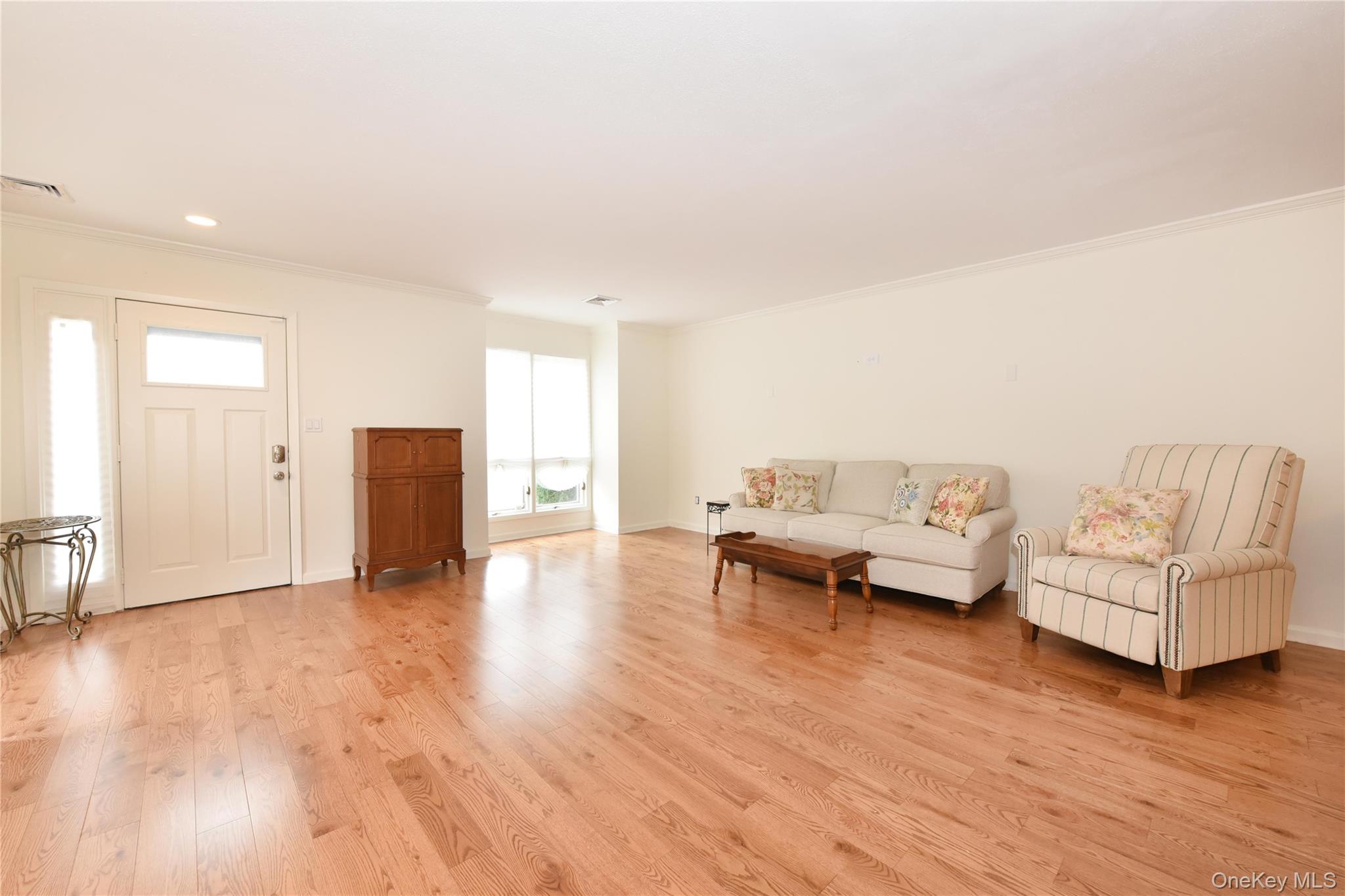 142 I U Willets Road Albertson, NY 11507 - Photo 13 of 32 a living room with furniture and a wooden floor