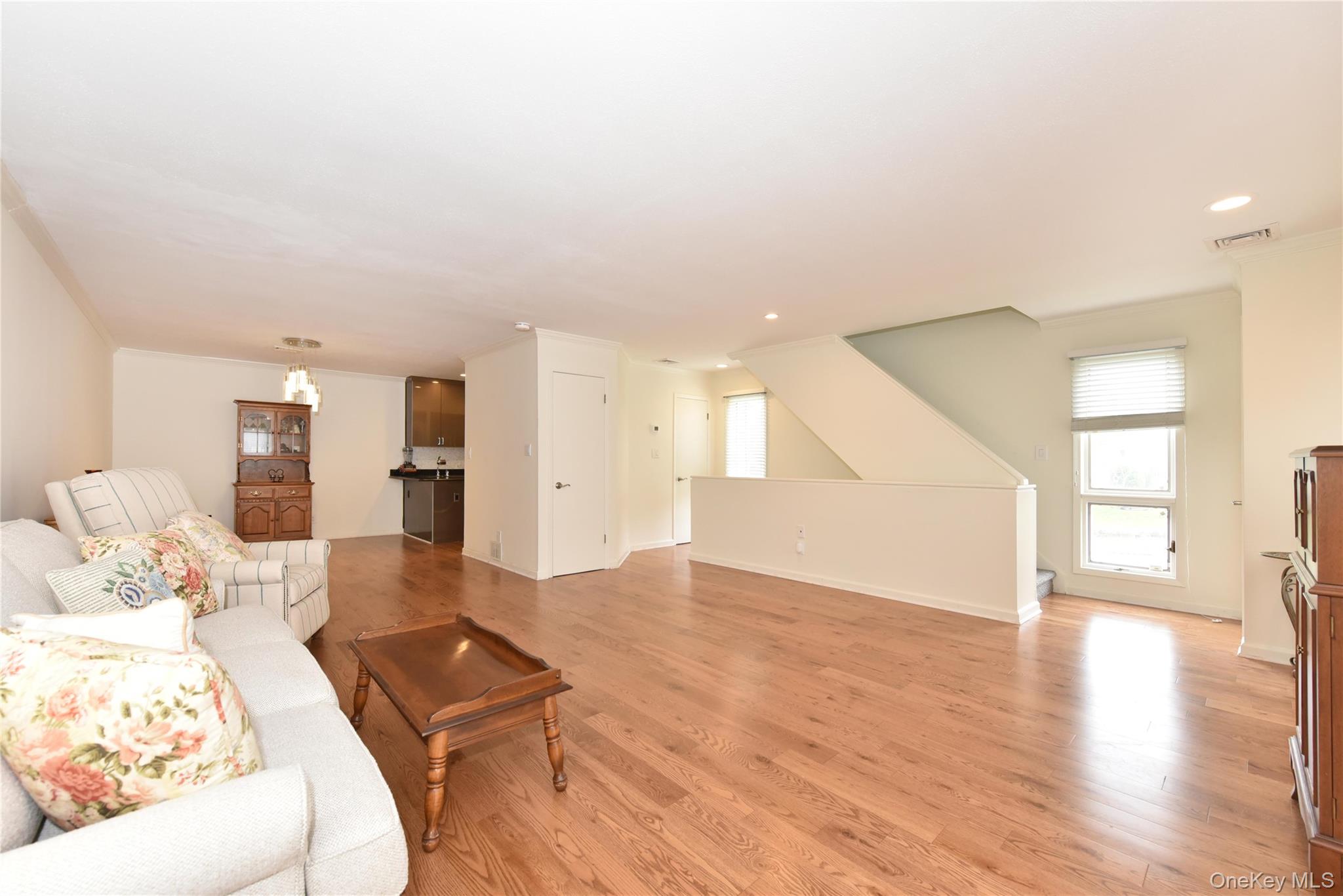 142 I U Willets Road Albertson, NY 11507 - Photo 16 of 32 a living room with furniture and wooden floor