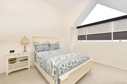 a bedroom with a bed and a cabinets