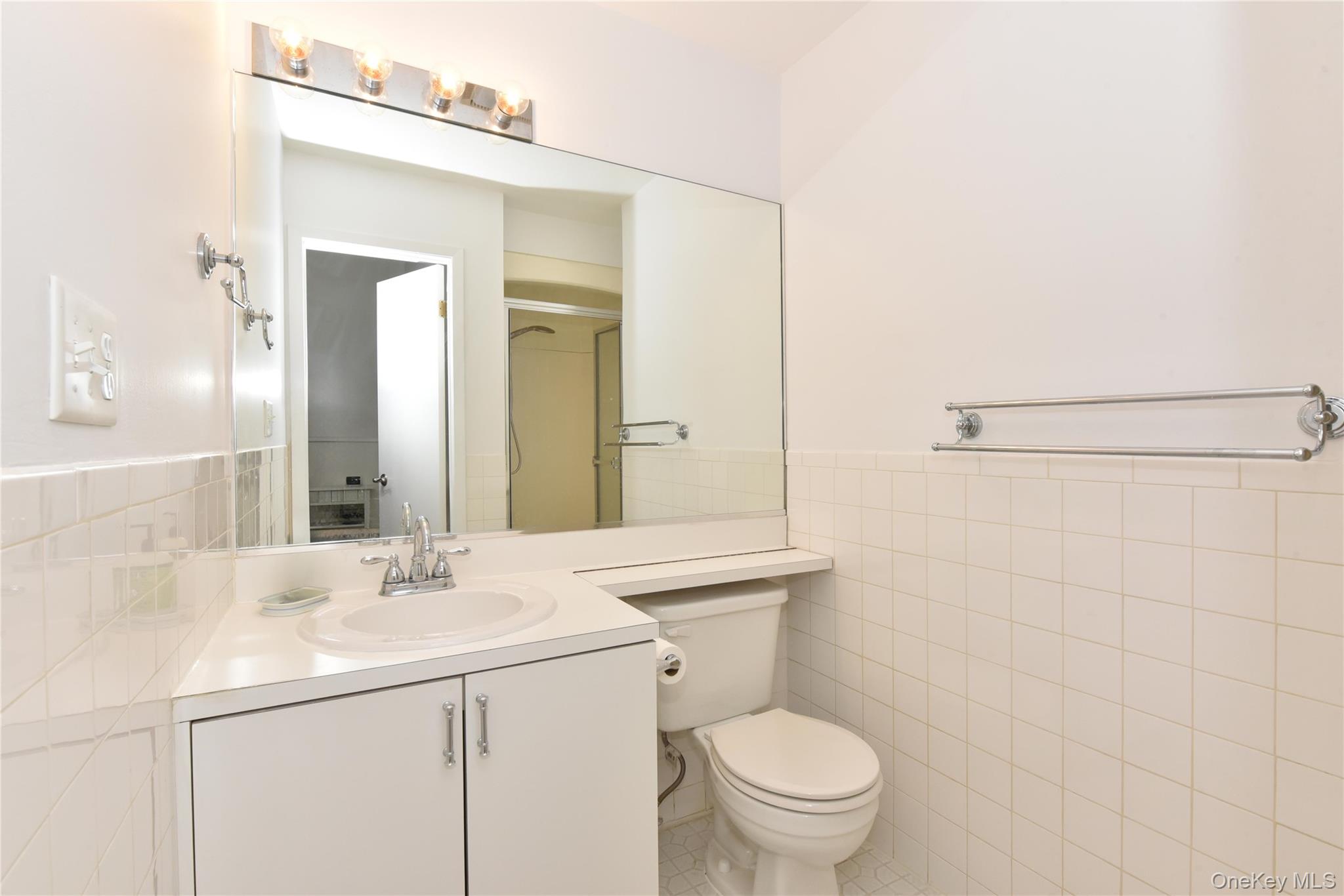 142 I U Willets Road Albertson, NY 11507 - Photo 26 of 32 a bathroom with a sink toilet and shower