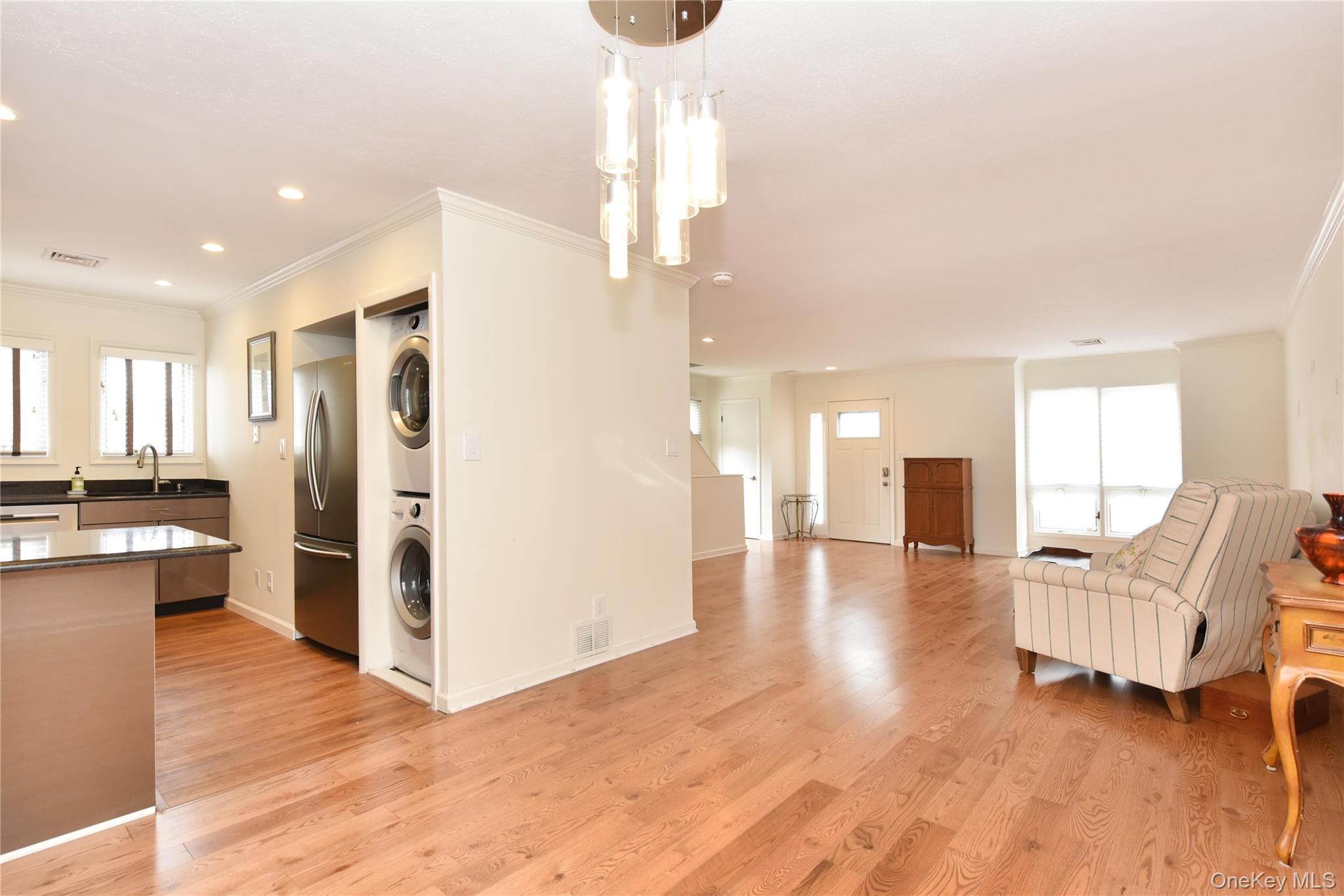 142 I U Willets Road Albertson, NY 11507 - Photo 10 of 32 a living room with furniture and a kitchen