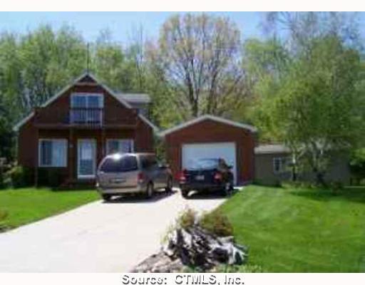 926 North Brinton Road Weidman, MI 48893 - Photo 1 of 1 a house view with a garden space