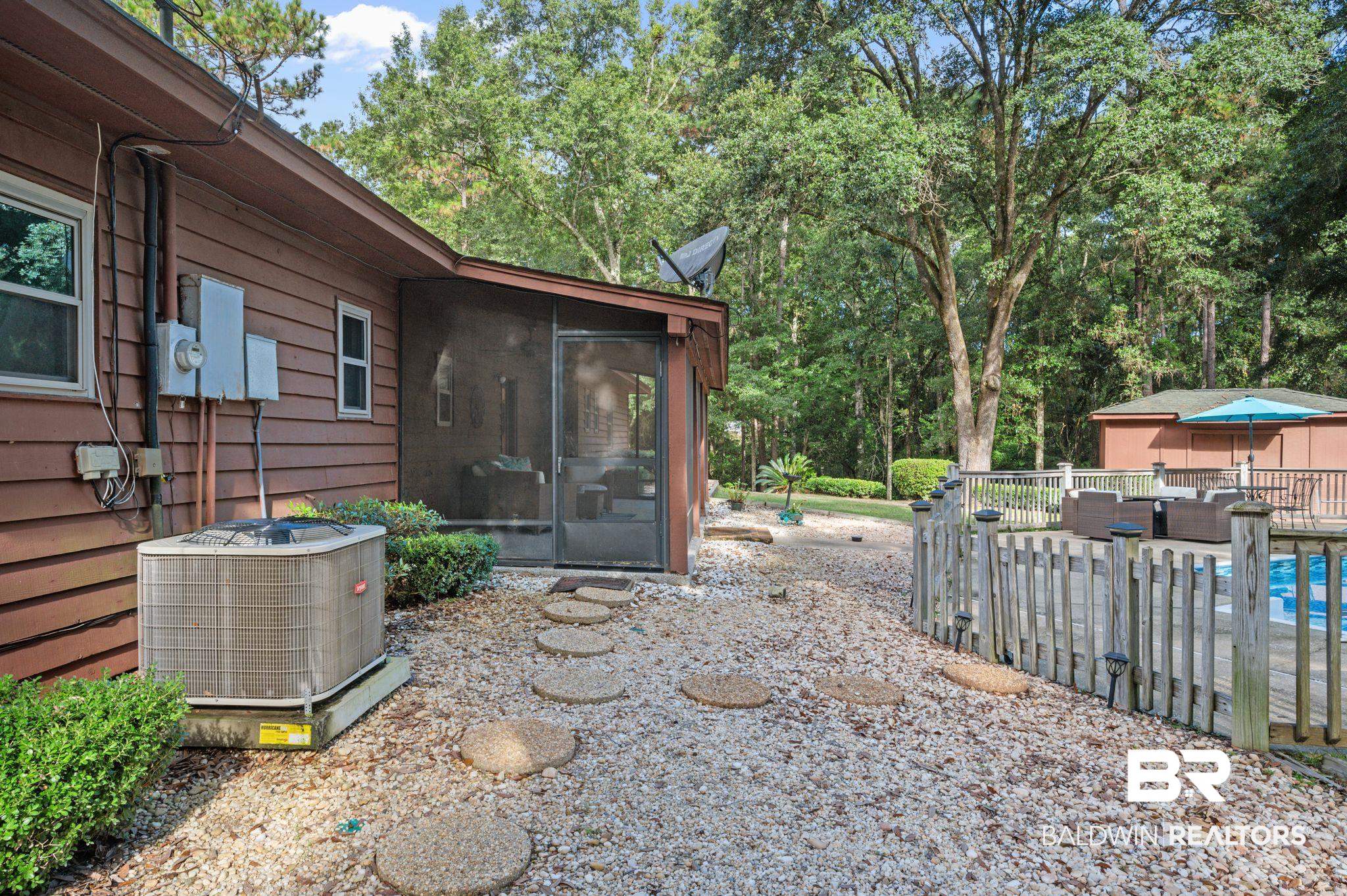 4566 McCrary Road, Unit A Semmes, AL 36575 - Photo 26 of 28 View of patio / terrace featuring cooling unit and a sunroom