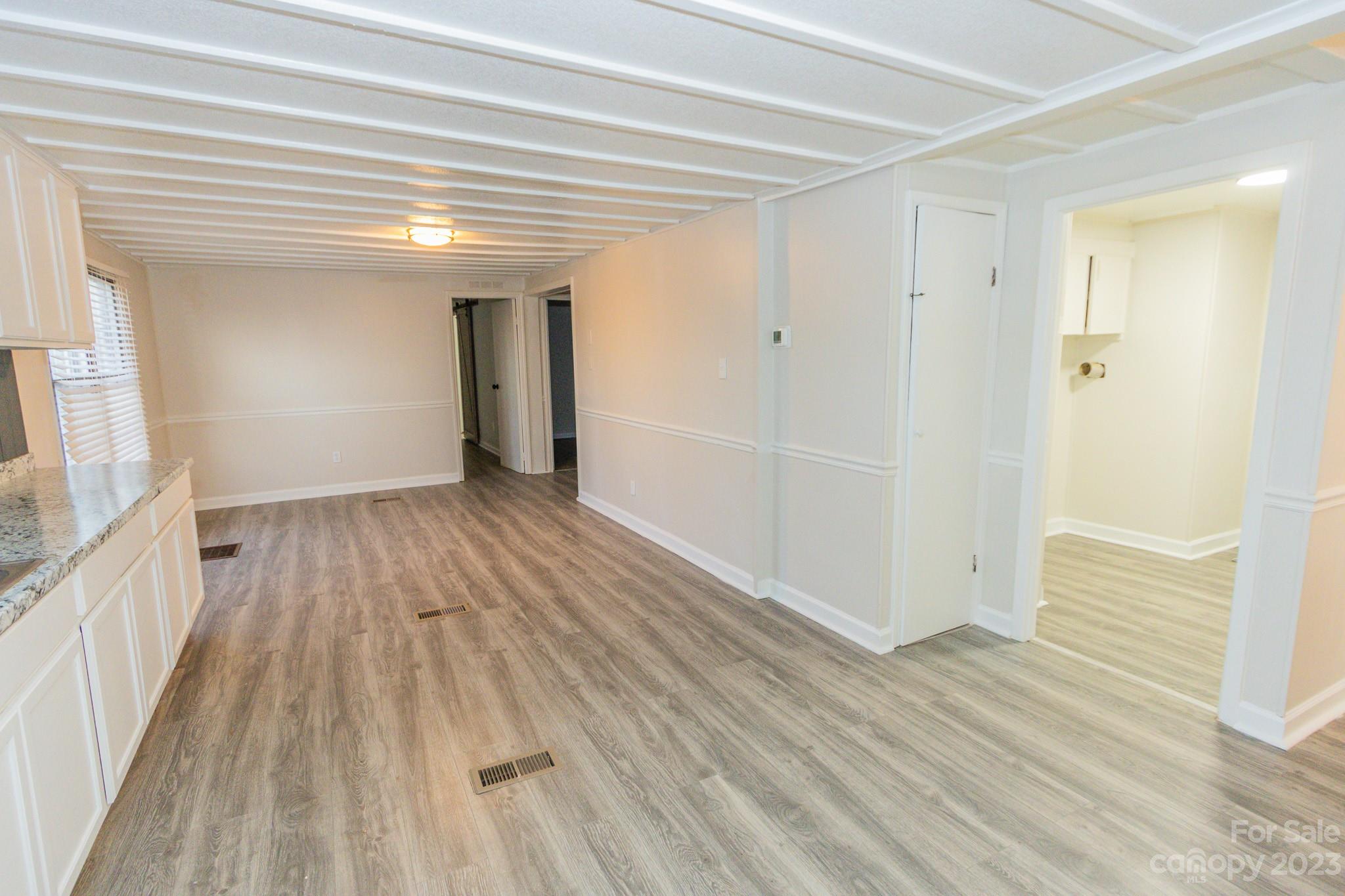 4634 Pleasant Road Heath Springs, SC 29058 - Photo 19 of 43 a view of a room with wooden floor and stairs