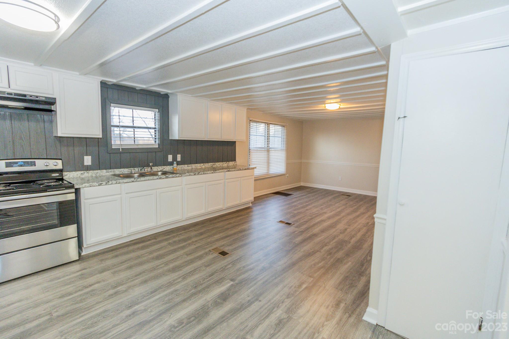 4634 Pleasant Road Heath Springs, SC 29058 - Photo 20 of 43 a kitchen with a sink and a stove top oven