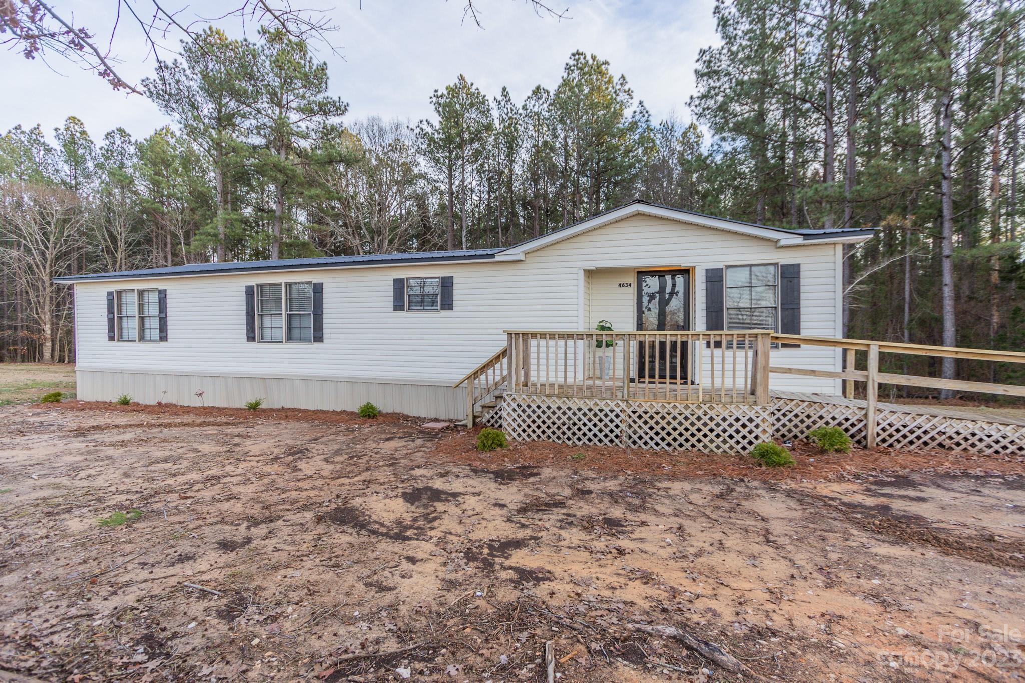 4634 Pleasant Road Heath Springs, SC 29058 - Photo 3 of 43 a house view with a garden