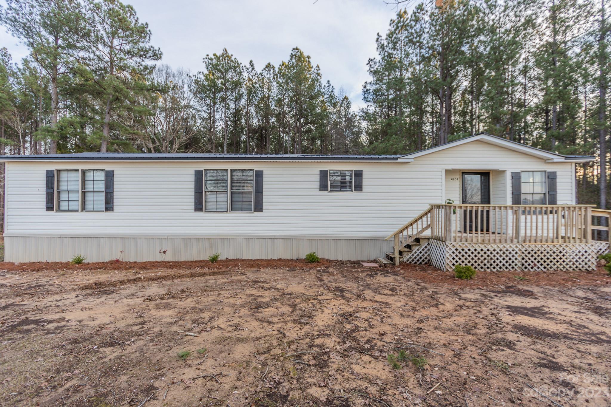 4634 Pleasant Road Heath Springs, SC 29058 - Photo 41 of 43 a house with trees in the background