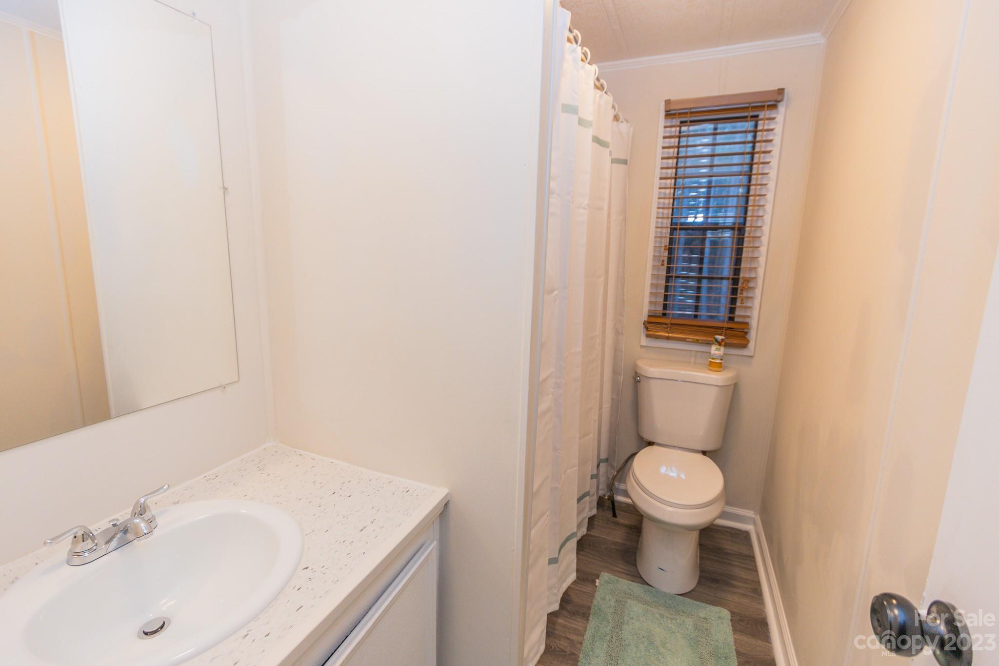 4634 Pleasant Road Heath Springs, SC 29058 - Photo 7 of 43 a bathroom with a sink and a toilet