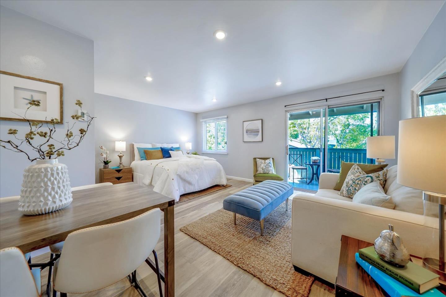 1126 Cherry Avenue, Unit 16 San Bruno, CA 94066 - Photo 11 of 32 a bedroom with furniture and a large window