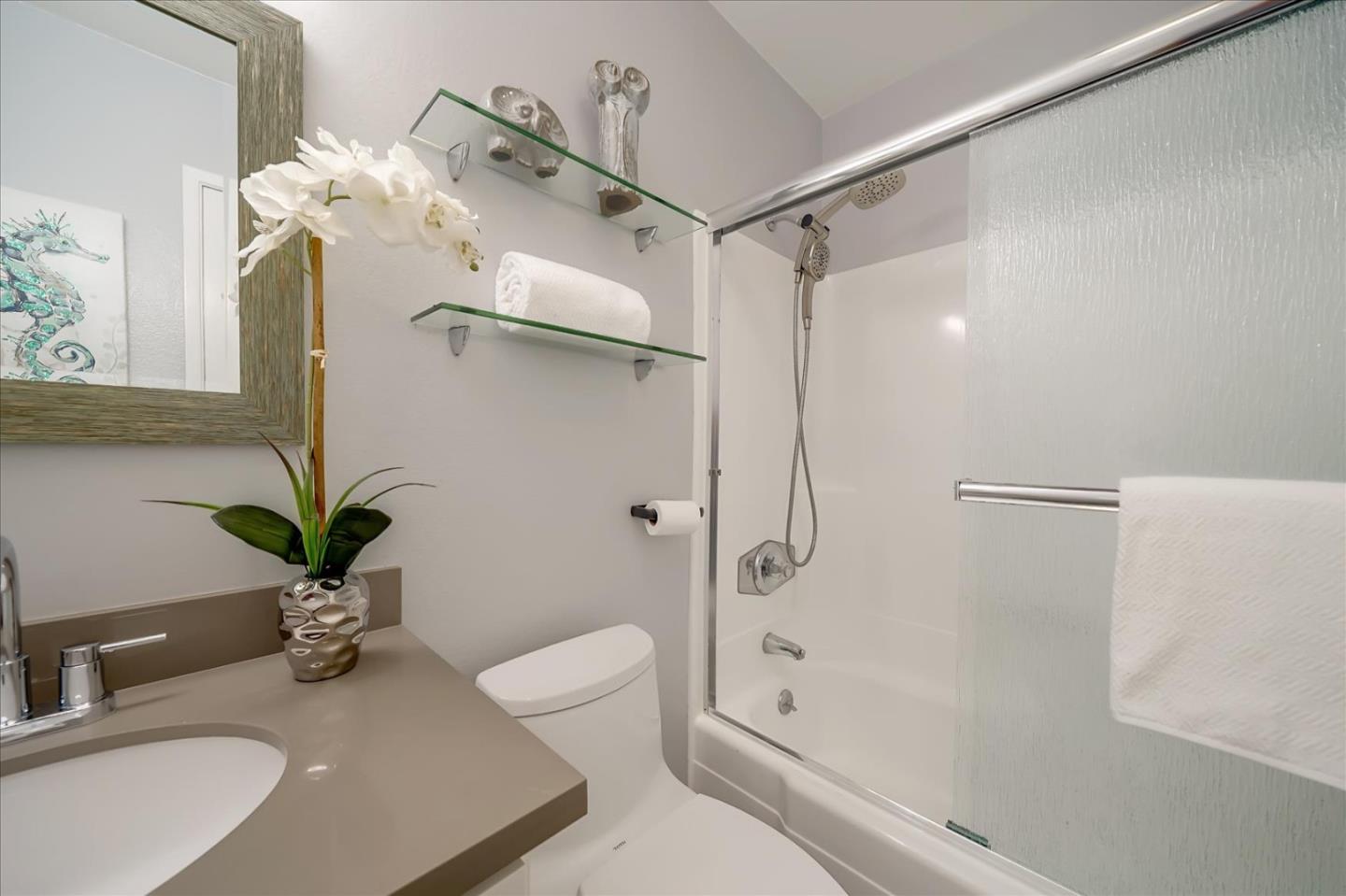 1126 Cherry Avenue, Unit 16 San Bruno, CA 94066 - Photo 17 of 32 a bathroom with a sink a toilet and shower