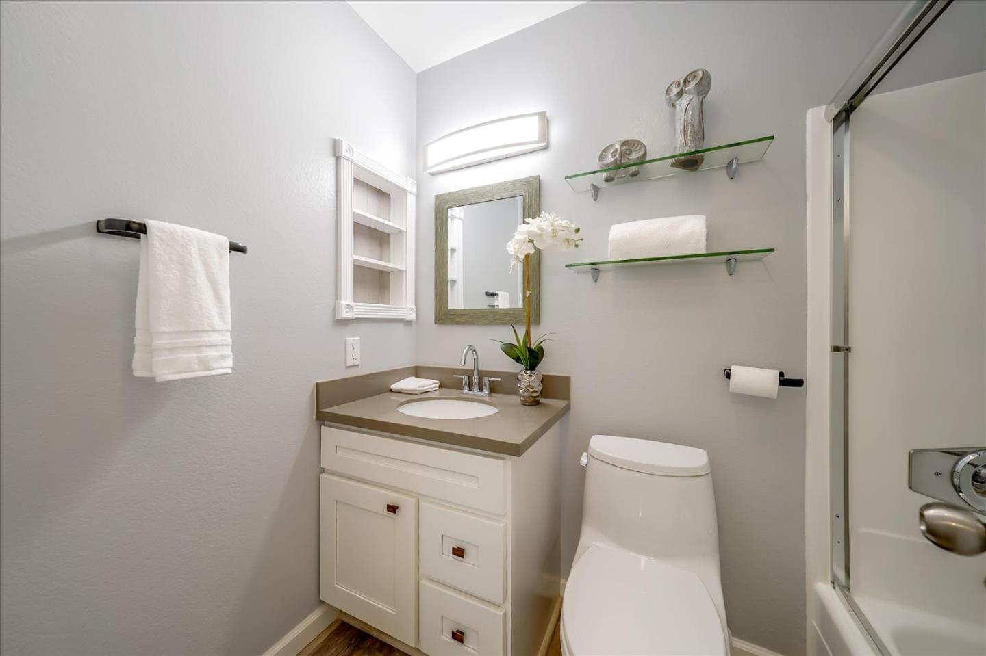 1126 Cherry Avenue, Unit 16 San Bruno, CA 94066 - Photo 18 of 32 a bathroom with a sink a toilet and shower